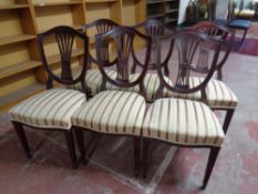 A set of six mahogany shield back dining chairs
