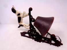 A cast iron Springer Spaniel wall bracket with bell