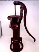 A cast iron garden water pump