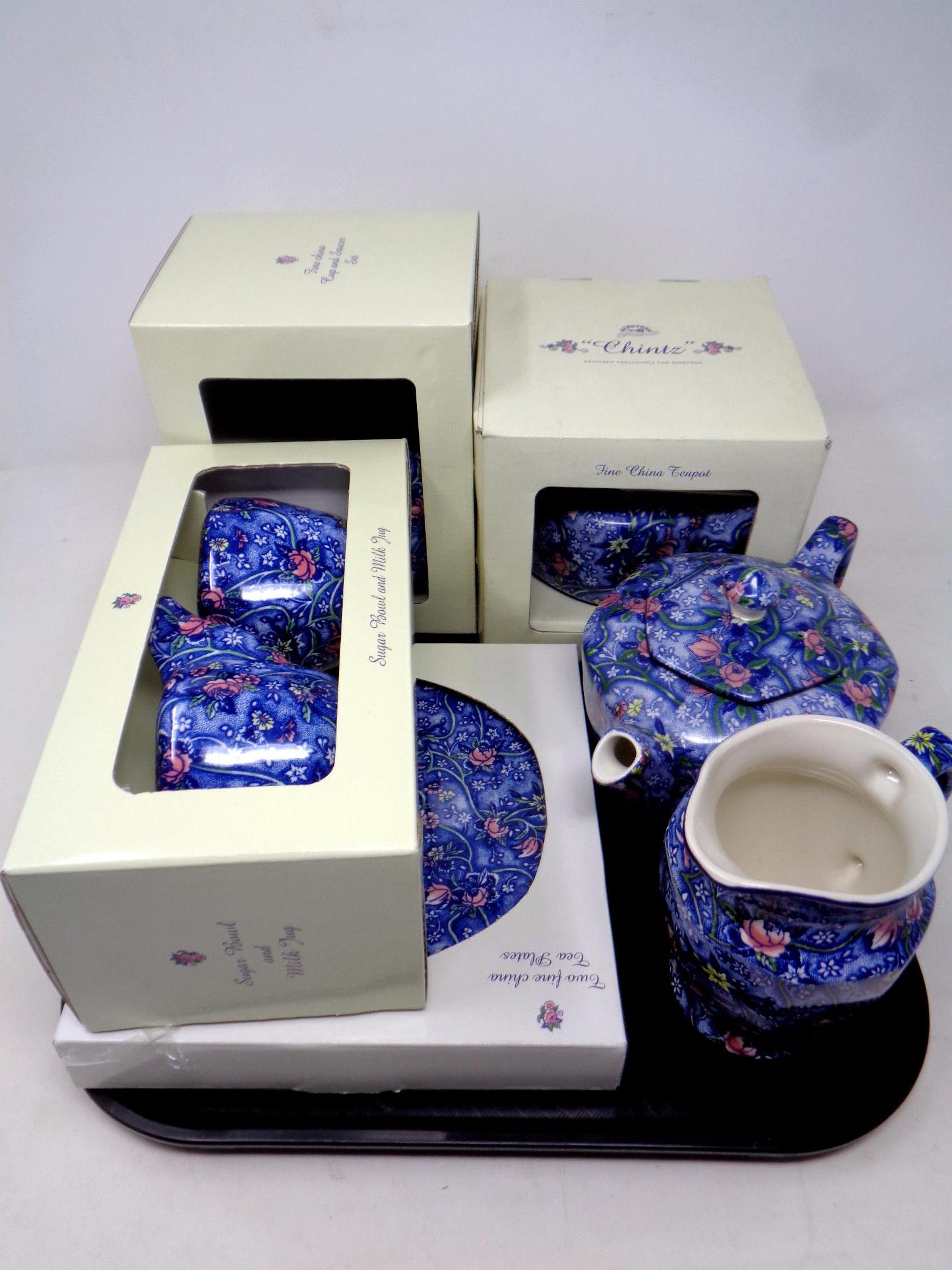 A tray containing Ringtons chintz tea ware