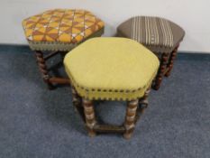 Three beech and oak hexagonal upholstered footstools