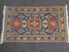 A Caucasian rug of geometric design,