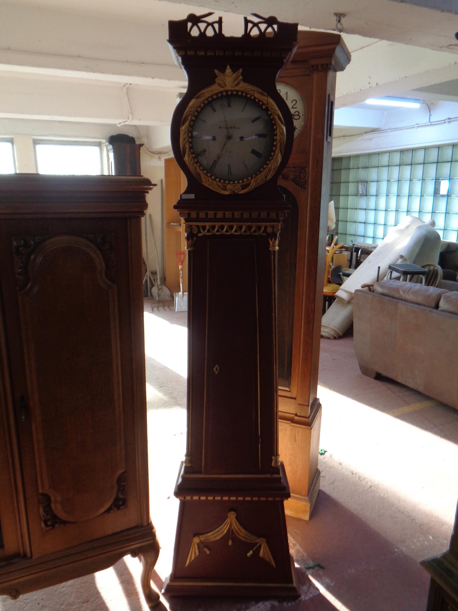 A continental painted longcase clock with circular dial