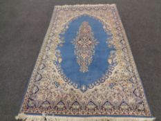 A Persian carpet on blue ground,
