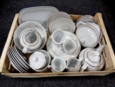 A box containing an extensive German white and gilt dinner service