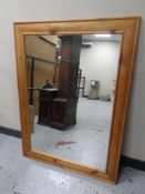 A stripped pine framed mirror