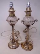 A pair of antique silver plated and cut glass oil lamps with shades (converted to electric)