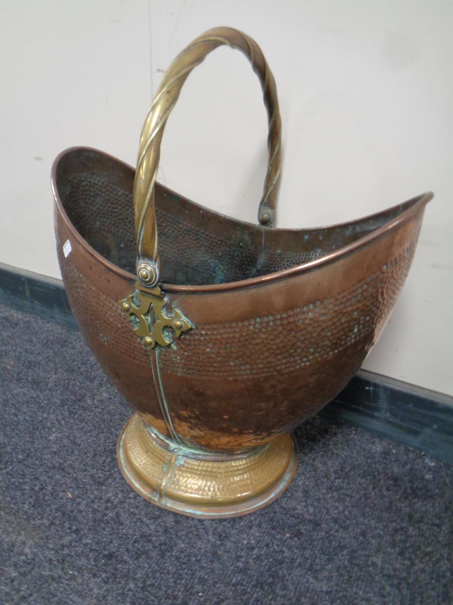 A 19th century hammered copper and brass coal bucket