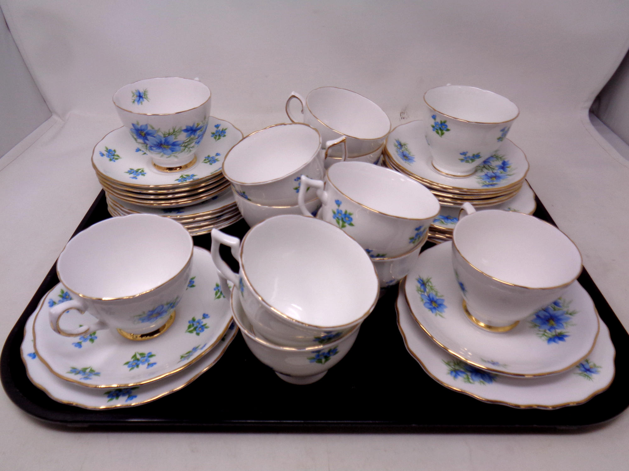 A tray containing six Melba and six Colclough china trios