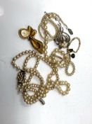 Four straps of costume pearls together with marcasite brooch and gold plated fob watch brooch.