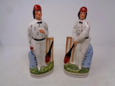 A pair of Staffordshire style cricketer figures together with a metal weather vane modelled as a