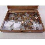 A wooden box containing a large quantity of pre decimal British coinage,