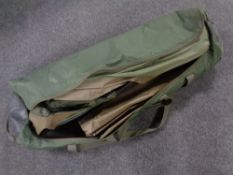 A Trakker fishing bivvy in carry bag