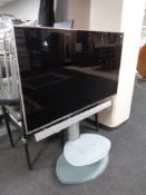 A Panasonic TX58 DX802B LED TV on stand with remote,