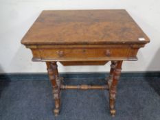 A Victorian carved walnut work table