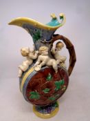 A Majolica jug, height 38cm CONDITION REPORT: Chips to rim.