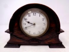 An Edwardian oak cased mantel clock