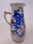 An antique hand painted porcelain jug, height 12.