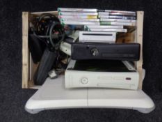 A box containing computer equipment to include two X Box 360 controls,