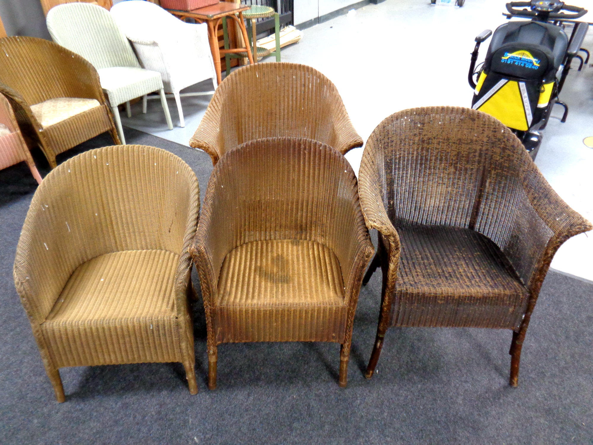 Four gold loom basket chairs