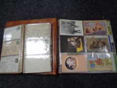 Two albums containing antiquarian and later postcards to include Disney, Tourist postcards,