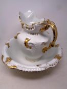 A Victorian ceramic white and gilt wash jug and basin