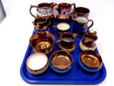 A tray containing twelve antique pieces of copper lustre ware to include jugs, bowls,