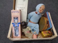 A box containing mid 20th century and later dolls, children's books, tambourine,