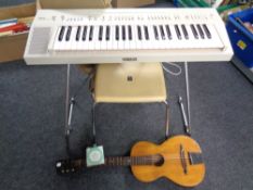 A 20th century Yamaha automatic bass chord keyboard on stand with stool and carry bag together with