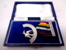 A silver masonic medal on ribbon in case