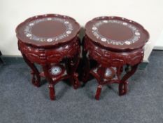 A pair of Japanese lacquered plant stands with mother of pearl inlay,