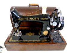 A 20th century Singer hand sewing machine in case