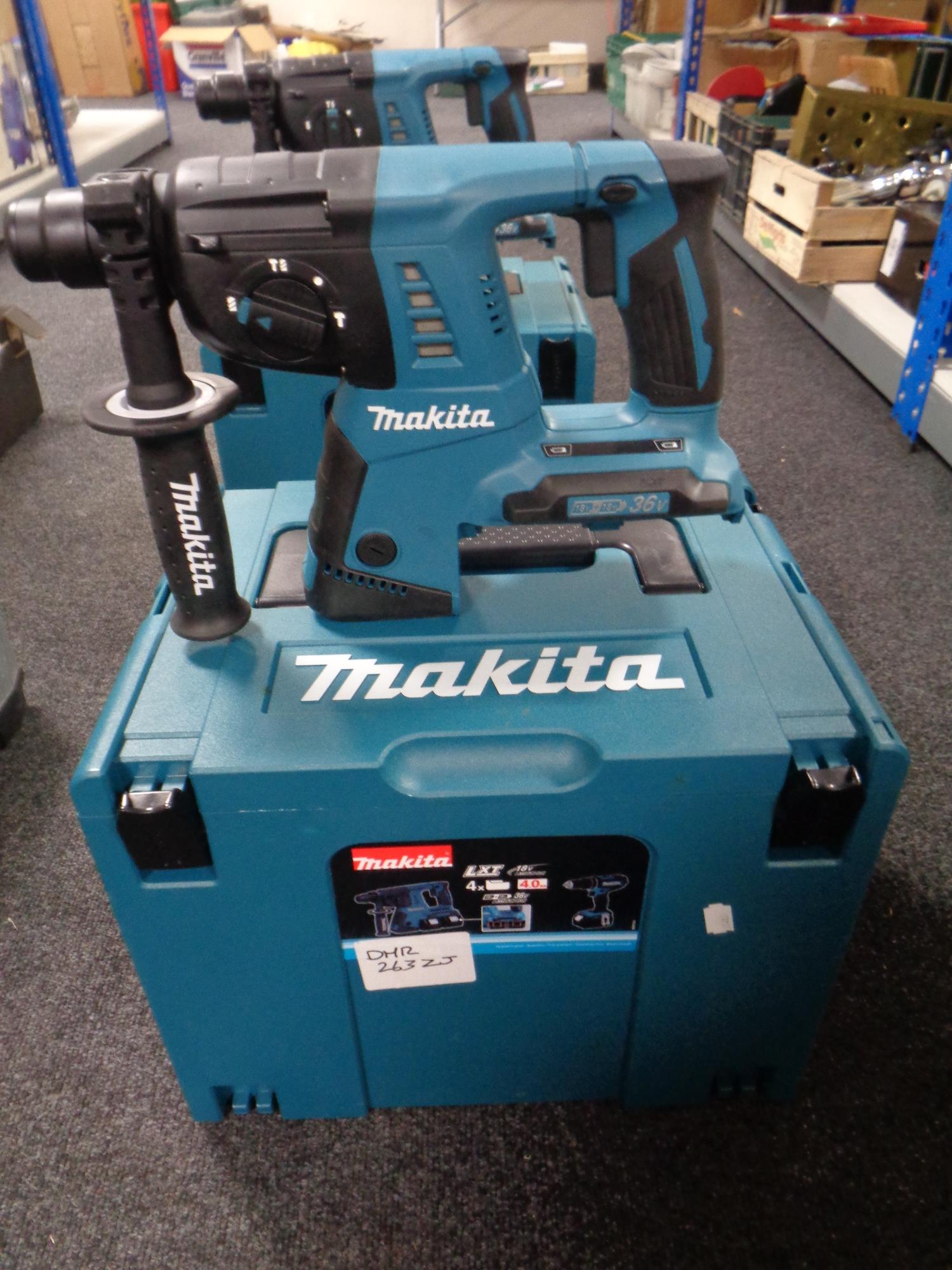 A Makita 36 V hammer drill in plastic case (no battery)