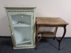 A shaped Edwardian oak two tier occasional table together with a painted glazed door corner cabinet
