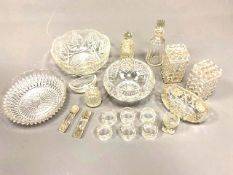 A collection of Victorian and later cut crystal and pressed glass to include bowls, knife rests,