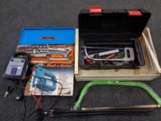 A box containing plastic toolbox containing hand tools, hand saws, battery charger,