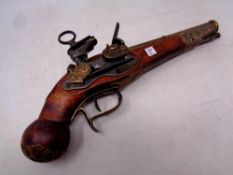 A replica flintlock pistol