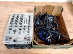 A Behringer VMX 300 control DJ mixer together with a box containing headphones and wires