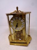 A Kundo brass cased anniversary clock