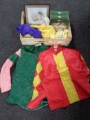 A box containing assorted racing silks to include Margaret Bemond racing colours,