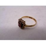 A 9 ct gold dress ring set with a garnet