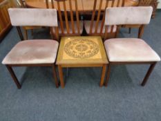 A mid 20th century Danish teak square tile topped coffee table together with a pair of teak dining