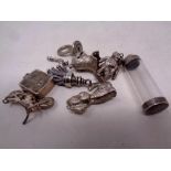 A quantity of silver and white metal charms