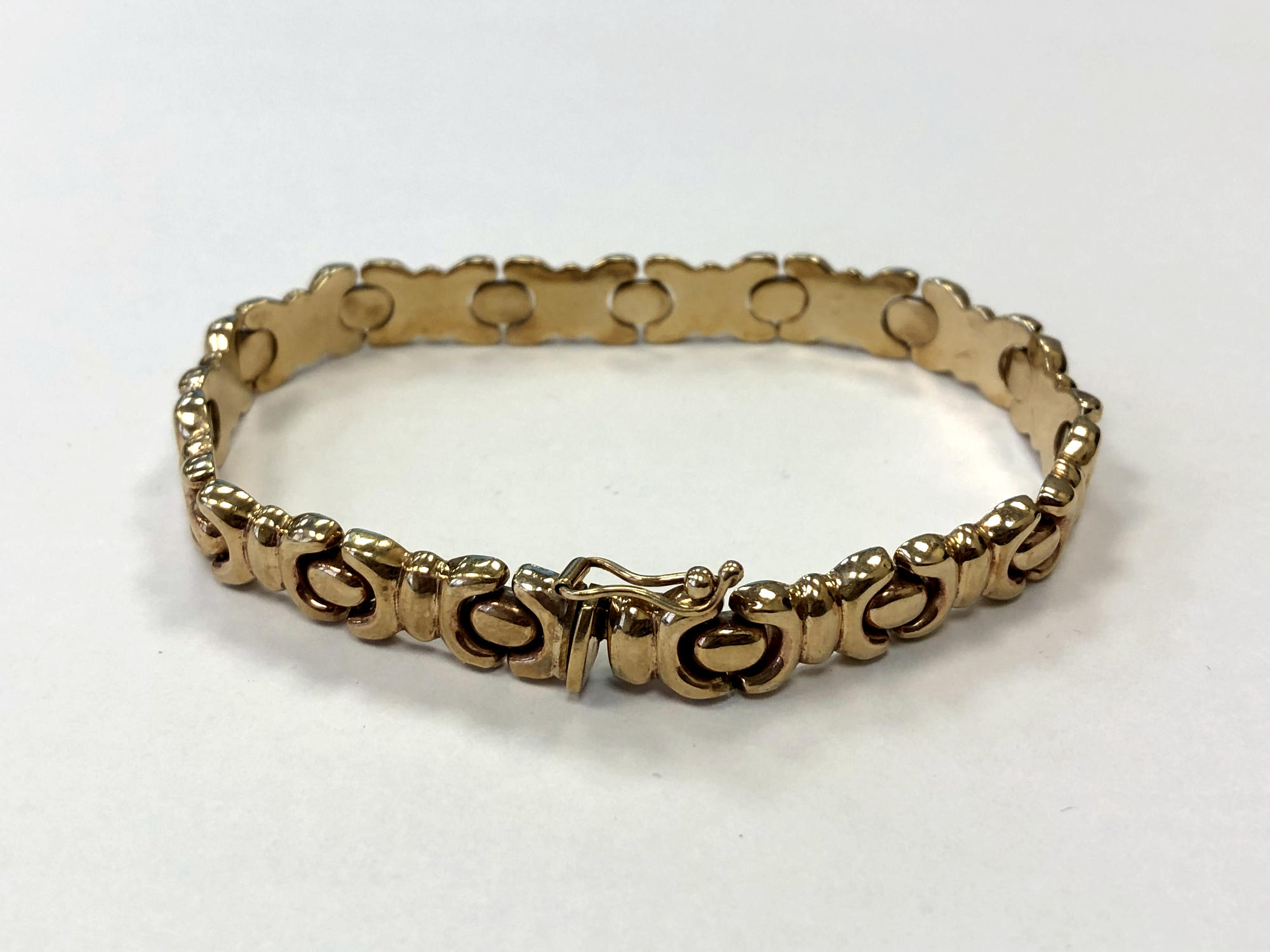 A 9ct gold fancy link bracelet CONDITION REPORT: 14.