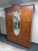 A 19th century inlaid mahogany mirror door wardrobe fitted two drawers beneath (a/f)