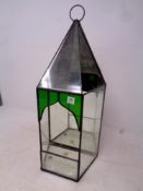 An antique leaded glass wall mounted terrarium