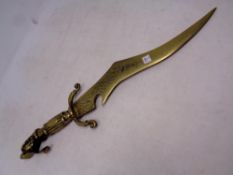 An ornamental brass middle eastern dagger