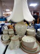 34 pieces of Denby Pottery tea and dinnerware together with a matching table lamp with shade