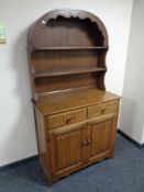 An oak linen fold Dutch dresser