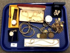 A tray containing silver and costume jewellery, wristwatch, coins, service badge,